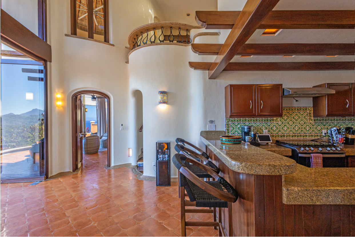 Stylish kitchen cabinetry and colorful decor enhancing the inviting atmosphere.