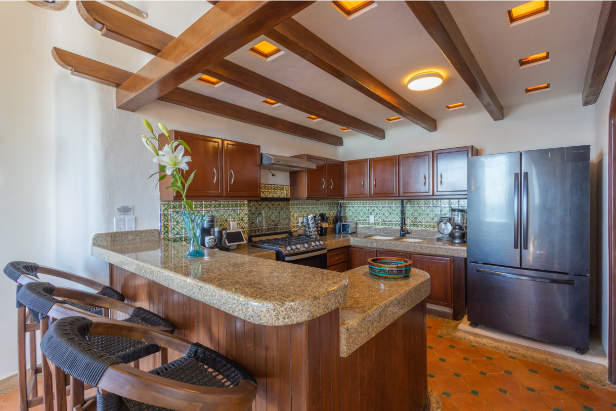 Spacious fully equipped kitchen with modern appliances and ocean views